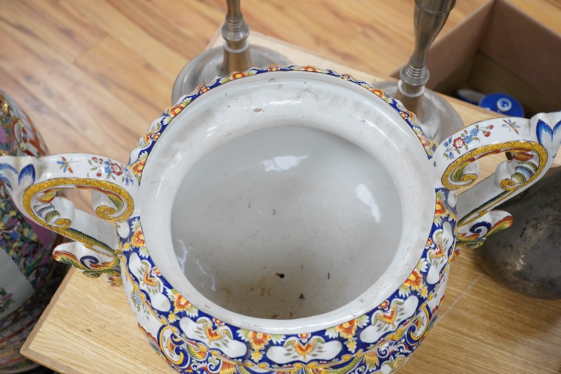 A large ornate two handled French faience planter, 39cm high
